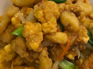 Chinese takeaway style salt and chilli chicken in a serving tray.