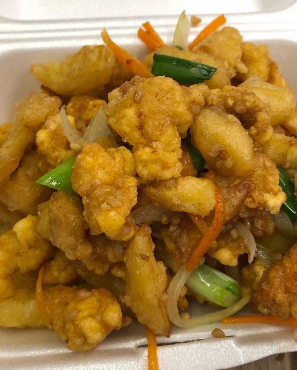 Chinese takeaway style salt and chilli chicken in a serving tray.