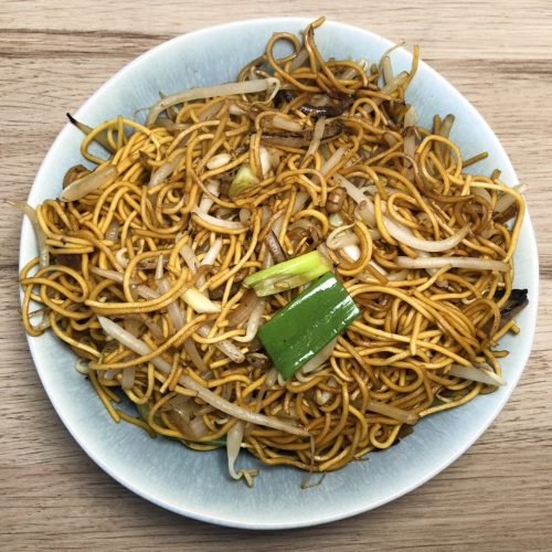 Chinese takeaway style Chow Mein with beansprouts on a serving plate.