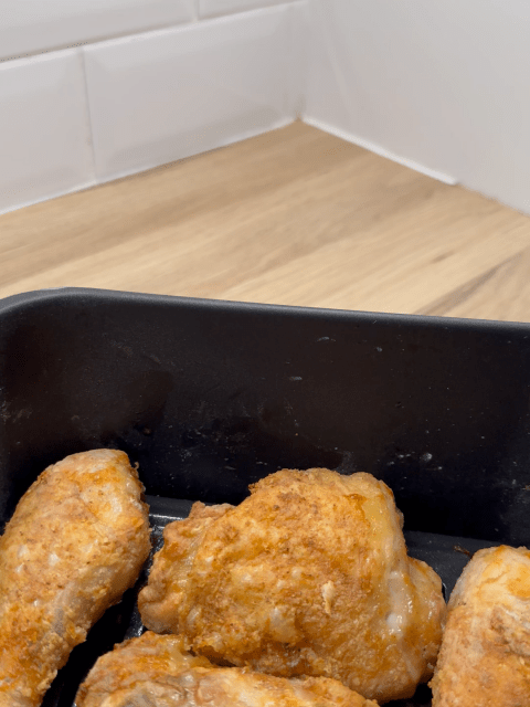 Air Fryer Fried Chicken with a golden crispy coating in an air fryer basket.