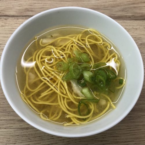 Chinese takeaway style chicken noodle soup in a serving bowl.