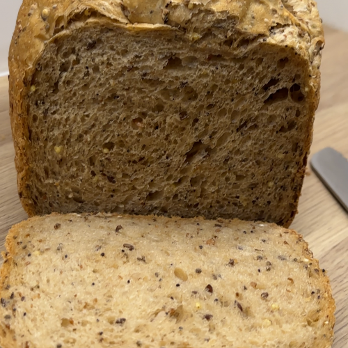 Breadmaker 6 Seed Loaf sliced on a kitchen countertop.
