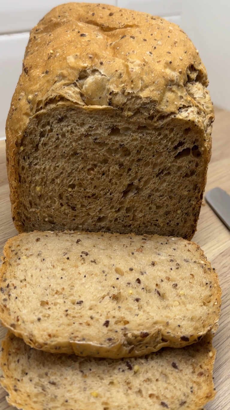 Breadmaker 6 Seed Loaf sliced on a kitchen countertop.