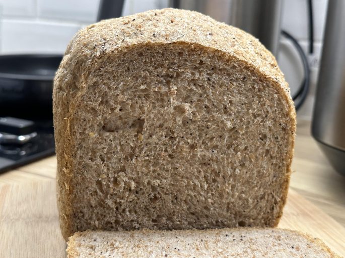 Seeded Wholemeal Bread (Bread Machine Method) A sliced wholemeal seeded bread loaf.