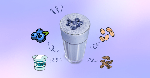 A blueberry smoothie in a tall serving glass.