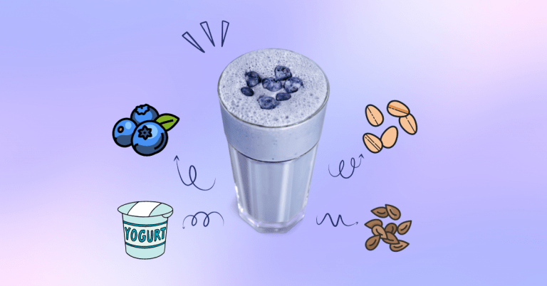 A blueberry smoothie in a tall serving glass.