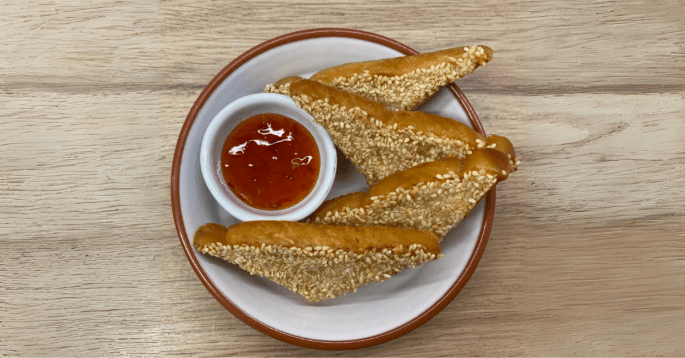 Sesame Prawn Toast (Chinese Takeaway Style) Chinese takeaway style sesame prawn toast with sweet chilli sauce on the side.