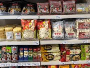 Chinese takeaway style cooking ingredients on a Chinese supermarket shelf.