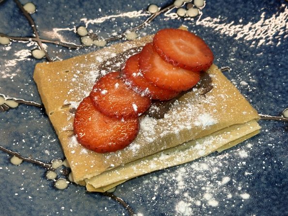 Street Food Style Strawberry Chocolate Crepes on a serving plate.