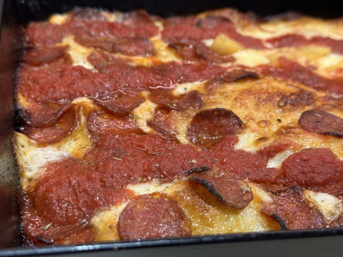 Detroit Style Pepperoni Pizza (American Fast-Food Style) Detroit style pepperoni pizza in a Detroit style baking pan.