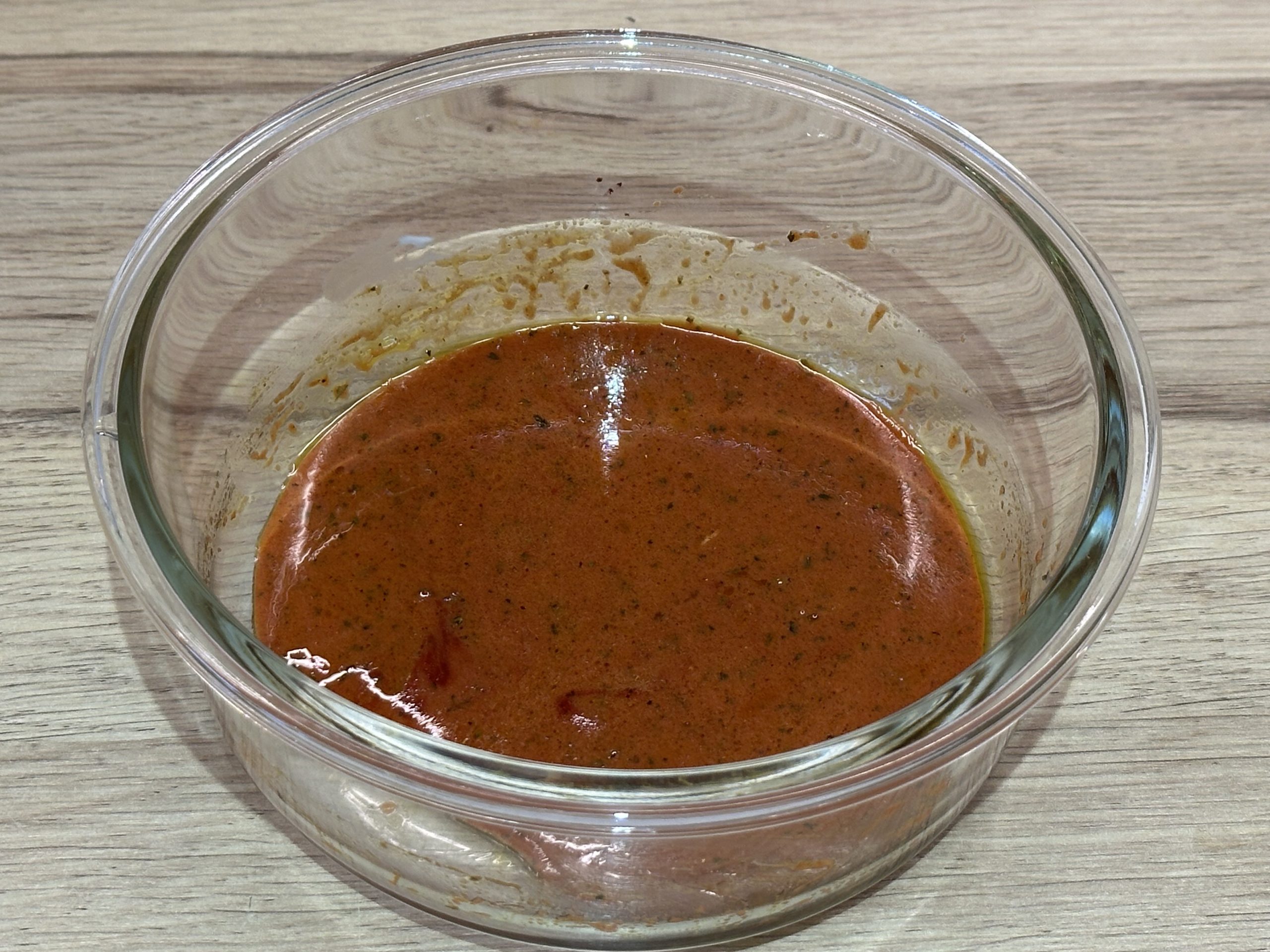 Chicken tikka marinade mixed in a large bowl.
