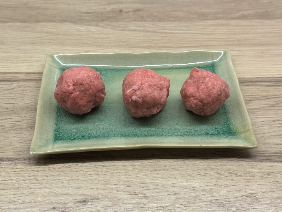 120g minced beef divided into three small meatballs.